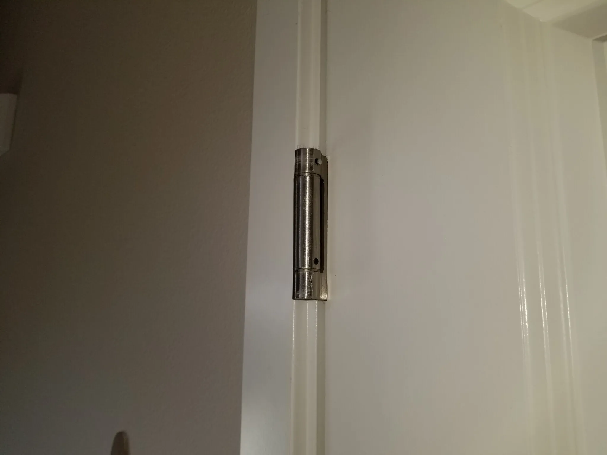 Self closing occupant door into garage