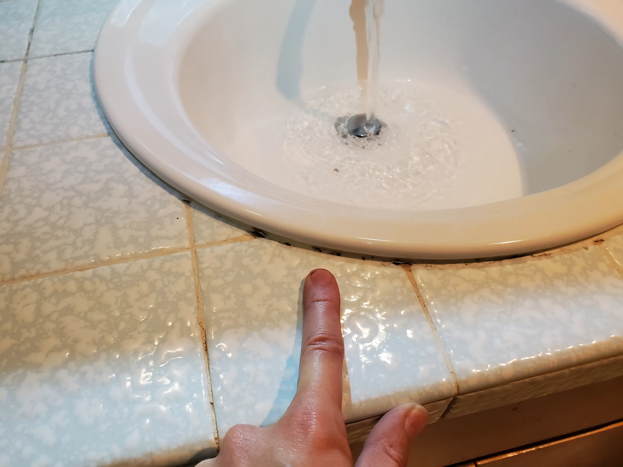 repair moldy caulk