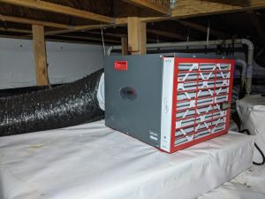 Photo of dehumidifier in an unvented crawlspace